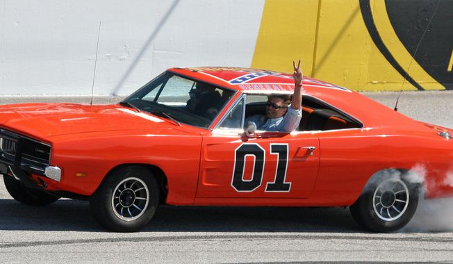In this March 9, 2008, file photo, actor John Schnieder, star of the 1980s television show &quot;The Dukes of Hazzard&quot;, waves from the General Lee before the Kobalt Tools 500 auto race at Atlanta Motor Speedway in Hampton, Ga. (AP Photo/Dale Davis) **FILE**
