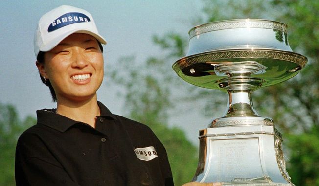 In this May 17, 1998, file photo, Se Ri Pak of South Korea poses with her trophy after winning the LPGA McDonald&#x27;s Championship at the DuPont Country Club in Rockland, Del. (Associated Press)