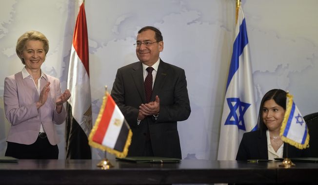 EU Commission President Ursula von der Leyen, left, Egyptian Minister of Petroleum Tarek El-Molla, center, and and Israeli Minister of Energy Israel&#x27;s Energy Minister Karine Elharrar, celebrate after signing a deal to boost East Mediterranean gas exports to Europe, in Cairo, Egypt, Wednesday, June 15, 2022. (AP Photo/Amr Nabil)