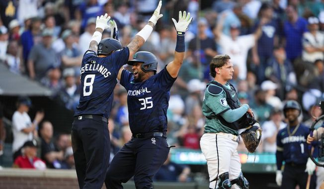 National League&#x27;s Elias Díaz, of the Colorado Rockies (35), celebrates his two run home run with Nick Castellanos (8), of the Philadelphia Phillies, in the eighth inning during the MLB All-Star baseball game in Seattle, Tuesday, July 11, 2023. (AP Photo/Lindsey Wasson) **FILE**