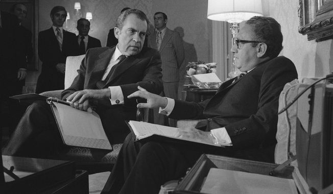 In this  Nov. 25, 1972, photo President Nixon confers with Henry A. Kissinger in New York after the presidential adviser returned from a week of secret negotiations in Paris with North Vietnam&#x27;s Le Duc Tho. Documents released Tuesday, Dec. 2, 2008, from the Nixon years shed new light on just how much the Nixon White House struggled with growing public unrest over the protracted war in Vietnam. (AP Photo/File)