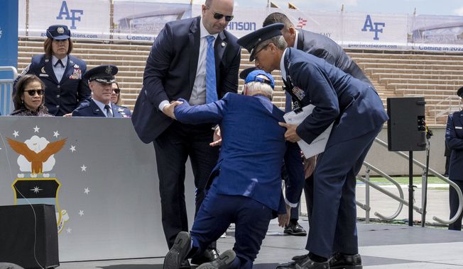 President Joe Biden falls on stage during the 2023 United States Air Force Academy Graduation Ceremony at Falcon Stadium, Thursday, June 1, 2023, at the United States Air Force Academy in Colorado Springs, Colo. (AP Photo/Andrew Harnik)