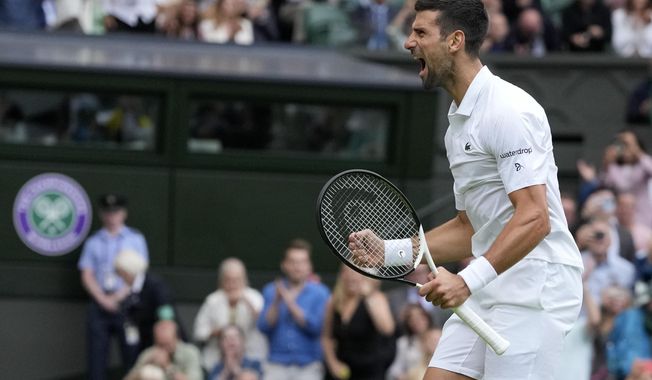 Serbia&#x27;s Novak Djokovic celebrates after beating Russia&#x27;s Andrey Rublev to win their men&#x27;s singles match on day nine of the Wimbledon tennis championships in London, Tuesday, July 11, 2023. (AP Photo/Kirsty Wigglesworth)