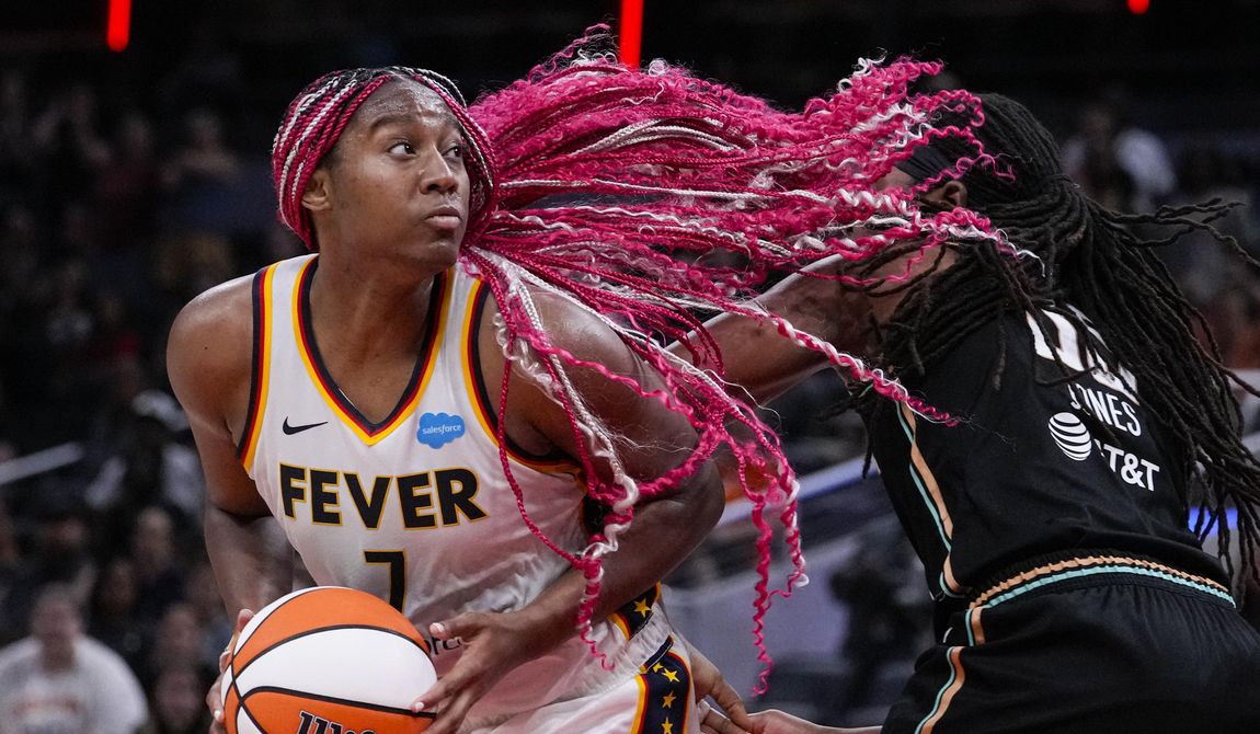 Indiana Fever forward Aliyah Boston (7) looks to shoot over New York Liberty forward Jonquel Jones (35) in the second half of a WNBA basketball game in Indianapolis, Wednesday, July 12, 2023. The Liberty defeated the Fever 95-87 in overtime. (AP Photo/Michael Conroy)