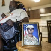 A portrait of American soldier Travis King is displayed as his grandfather, Carl Gates, talks about his grandson Wednesday, July 19, 2023, in Kenosha, Wis. Pvt. King bolted into North Korea while on a tour of the Demilitarized Zone on Tuesday, July 18, a day after he was supposed to travel to a base in the U.S. (AP Photo/Morry Gash)