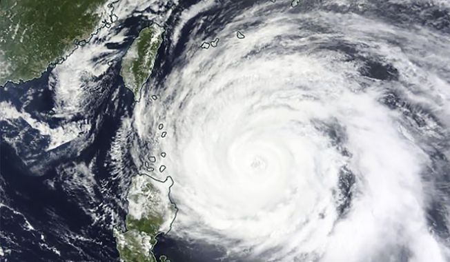 This Monday, May 29, 2023, satellite image released by NASA shows Typhoon Mawar approaching the Philippines&#x27; northern provinces. (NASA Worldview, Earth Observing System Data and Information System — EOSDIS — via AP)