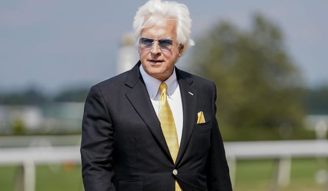 Trainer Bob Baffert walks off the track after his horse Arabian Lion won The Woody Stephens ahead of the Belmont Stakes horse race Saturday, June 10, 2023, at Belmont Park in Elmont, N.Y. (AP Photo/Mary Altaffer)