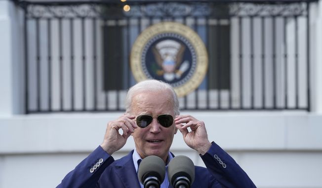 President Biden takes off  his sunglasses as he speaks from the South Lawn of the White House in Washington, Tuesday, July 4, 2023, during a barbecue with active-duty military families to celebrate the Fourth of July. (AP Photo/Susan Walsh)