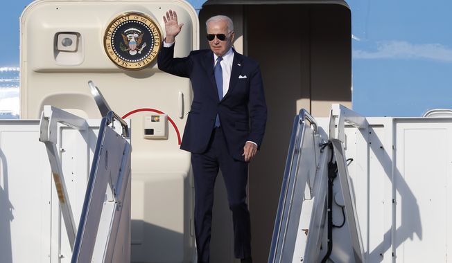President Biden waves as he steps off Air Force One on arrival at Vilnius airport ahead of a NATO summit in Vilnius, Lithuania, Monday, July 10, 2023. Russia&#x27;s war on Ukraine will top the agenda when NATO leaders meet in the Lithuanian capital Vilnius on Tuesday and Wednesday. (AP Photo/Mindaugas Kulbis)