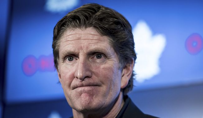 In this April 25, 2019, file photo, Toronto Maple Leafs coach Mike Babcock speaks to reporters in Toronto. Babcock is back in the NHL as coach of the Columbus Blue Jackets. The Blue Jackets announced Saturday, July 1, 2023, they’ve hired the Stanley Cup winner to take over behind the bench.(Christopher Katsarov/The Canadian Press via AP, File)