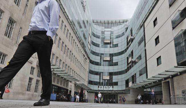A view of the main entrance to the headquarters of the publicly funded BBC in London, Wednesday, July 19, 2017. Senior British politicians on Sunday, July 9, 2023 called on the BBC to rapidly investigate a complaint that a leading presenter paid a teenager for explicit photos. The publicly funded national broadcaster is under pressure after The Sun newspaper reported allegations that the male presenter gave a youth 35,000 pounds, or $45,000, starting in 2020 when the young person was 17. (AP Photo/Frank Augstein, File)