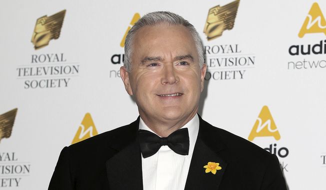 Journalist Huw Edwards poses for photographers upon arrival at the Royal Television Society Programme Awards at the Grosvenor Hotel in London, Tuesday, March 21, 2017. London police say there&#x27;s no evidence that a BBC presenter who allegedly paid a teenager for sexually explicit photos committed a crime. The Metropolitan police issued the statement Wednesday, July 12, 2023 as the wife of Huw Edwards identified him as the presenter.  (AP Photo/Tim Ireland, File)