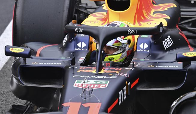 Red Bull driver Sergio Perez of Mexico steers his car during the qualifying session at the British Formula One Grand Prix at the Silverstone racetrack, Silverstone, England, Saturday, July 8, 2023. The British Formula One Grand Prix will be held on Sunday. (Christian Bruna/Pool photo via AP)