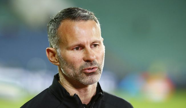 Wales coach Ryan Giggs talks to media prior to the UEFA Nations League soccer match between Bulgaria and Wales at Vassil Levski national stadium in Sofia, Bulgaria, Wednesday, Oct. 14, 2020. Former Manchester United winger Ryan Giggs&#x27; retrial on charges of domestic violence will not go ahead this month after prosecutors pulled out of the case. Giggs, one of the greatest modern-day players in British soccer, was due to go on trial for a second time starting July 31, 2023, accused of controlling or coercive behavior toward his former girlfriend, Kate Greville, between August 2017 and November 2020. (AP Photo/Anton Uzunov, File)