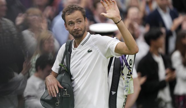 Russia&#x27;s Daniil Medvedev leaves the court after losing to Spain&#x27;s Carlos Alcaraz in their men&#x27;s singles semifinal match on day twelve of the Wimbledon tennis championships in London, Friday, July 14, 2023. (AP Photo/Alberto Pezzali)