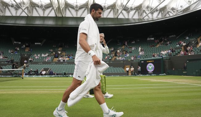 Serbia&#x27;s Novak Djokovic leaves the court after practicing on Court One ahead of his men&#x27;s singles semifinal match against Italy&#x27;s Jannik Sinner on day twelve of the Wimbledon tennis championships in London, Friday, July 14, 2023. (AP Photo/Alberto Pezzali)