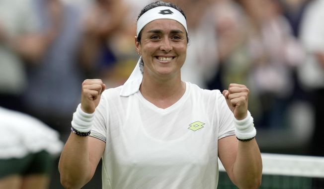 Tunisia&#x27;s Ons Jabeur celebrates winning against Aryna Sabalenka of Belarus during their women&#x27;s semifinal singles match on day eleven of the Wimbledon tennis championships in London, Thursday, July 13, 2023. (AP Photo/Kin Cheung)