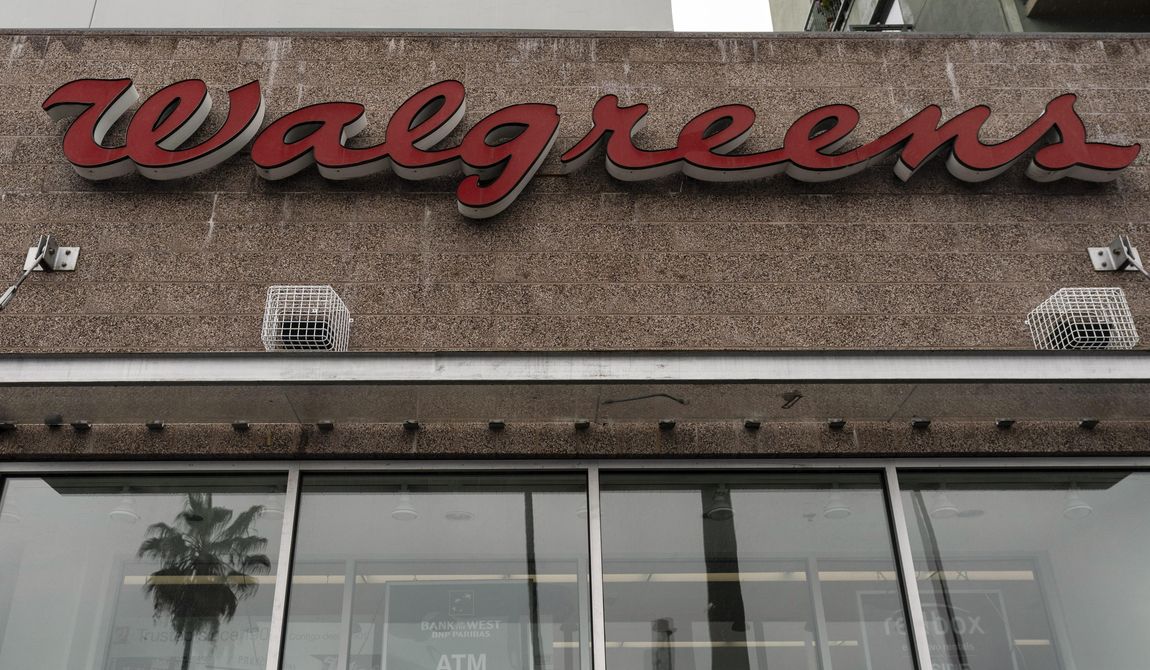 A palm tree is reflected in the window of a Walgreens pharmacy in Los Angeles, Friday, March 10, 2023. California&#x27;s Medicaid program will continue to pay Walgreens about $1.5 billion each year. That&#x27;s despite Gov. Gavin Newsom declaring last month that the state would no longer do business with the pharmacy giant. (AP Photo/Jae C. Hong, File)