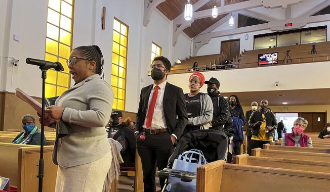 People line up to speak during a reparations task force meeting at Third Baptist Church in San Francisco on April 13, 2022. A report by California&#x27;s first-in-the-nation task force on reparations Wednesday, June 1 will document in detail the harms perpetuated by the state against Black people and recommend ways to address those wrongs. (AP Photo/Janie Har) **FILE**