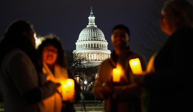 Christian leaders gather ahead of a prayer vigil to mark the second year anniversary of the violent insurrection by supporters of then-President Donald Trump, on Capitol Hill in Washington, Friday, Jan. 6, 2023. (AP Photo/Matt Rourke)