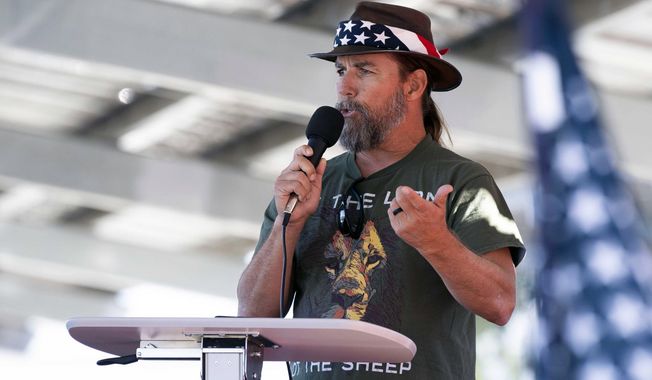 Alan Hostetter speaks during a pro-Trump election integrity rally he organized at the Orange County Registrar of Voters offices in Santa Ana, Calif., Nov. 9, 2020. A former California police chief was convicted on Thursday, July 13, 2023, of joining the riot at the U.S. Capitol with a hatchet in his backpack and plotting to stop Congress from certifying President Joe Biden&#x27;s 2020 electoral victory. A judge in Washington&#x27;s federal court heard testimony without a jury before convicting Hostetter, a right-wing activist and vocal critic of COVID-19 restrictions who defended himself at his bench trial with help from a standby attorney. (Paul Bersebach/The Orange County Register via AP, File)