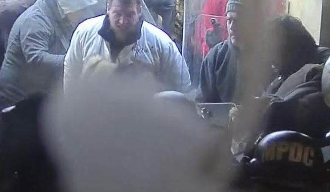 In this image from U.S. Capitol Police security video, released and annotated by the Justice Department in the Statement of Facts supporting an arrest warrant, Kyle Fitzsimons appears near a door to the U.S. Capitol on Jan. 6, 2021, in Washington. Fitzsimons was sentenced Thursday, July 13, 2023, to more than seven years in prison for hurling a bow like a spear at police and attacking several other officers on Jan. 6. (Justice Department via AP)