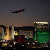 A plane takes off from Harry Reid International Airport near casinos along the Las Vegas Strip, Wednesday, Sept. 29, 2021, in Las Vegas. Nevada&#x27;s tourism economy is putting the coronavirus pandemic behind it, with regulators reporting the best casino winnings ever for a February and the airport serving Las Vegas announcing plans to resume nonstop international flights in April. The Nevada Gaming Control Board on Wednesday, March 30, 2022 reported a 12th straight month of $1 billion or more in casino house winnings, a key index of state economic health. The state reaped almost $59 million in casino taxes based on the figure, up more than 34% from a year ago. (AP Photo/John Locher, File)