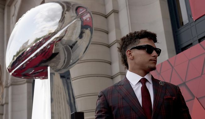 Kansas City Chiefs quarterback Patrick Mahomes arrives at a ceremony for team members to receive their championship rings for winning NFL football&#x27;s Super Bowl LVII, Thursday, June 15, 2023, in Kansas City, Mo. (AP Photo/Charlie Riedel)
