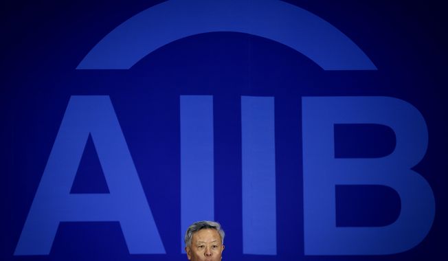 Jin Liqun, inaugural president of the Asian Infrastructure Investment Bank (AIIB), speaks during a press conference at a hotel in Beijing, on Jan. 17, 2016. A Canadian public relations manager for the Chinese-founded development bank announced his resignation Wednesday, June 14, 2023 in a statement that accused it of being dominated by &quot;Communist Party hacks&quot; and said Canada&#x27;s interests weren&#x27;t served by being a member. (AP Photo/Andy Wong, File)