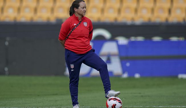 Twila Kilgore, assistant coach on the U.S. team watches players warm up prior to a CONCACAF Women&#x27;s Championship soccer semifinal match against Costa Rica in Monterrey, Mexico, Thursday, July 14, 2022. Kilgore, is an assistant for the U.S. women’s national team and one of just four women in the United States who hold the U.S. Soccer Federation’s elite pro license.(AP Photo/Fernando Llano, File)
