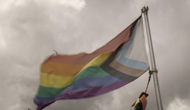 A pride flag is flown outside Club Q, the LGBTQ nightclub that was the site of a deadly 2022 shooting that killed five people, on Wednesday, June 7, 2023 in Colorado Springs, Colo. (AP Photo/Chet Strange) ** FILE **