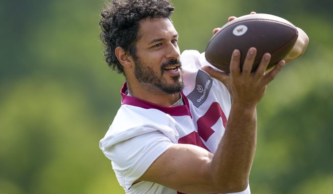Washington Commanders tight end Logan Thomas (82) catches a pass during practice at the team&#x27;s NFL football training facility, Wednesday, May 24, 2023 in Ashburn, Va. (AP Photo/Alex Brandon)