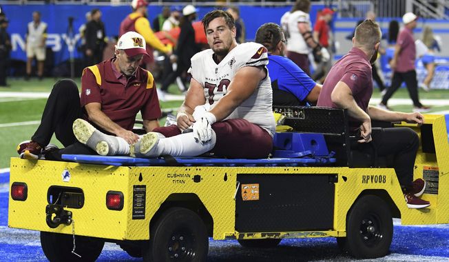 Washington Commanders center Chase Roullier (73) leaves the field on a cart after an injury during the second half of an NFL football game against the Detroit Lions Sunday, Sept. 18, 2022, in Detroit. The Washington Commanders are releasing center Chase Roullier with a post-June 1 designation, according to a person with knowledge of the decision. The person spoke to The Associated Press on condition of anonymity Friday, May 5, 2023, because the team had not announced the move. (AP Photo/Lon Horwedel, File)