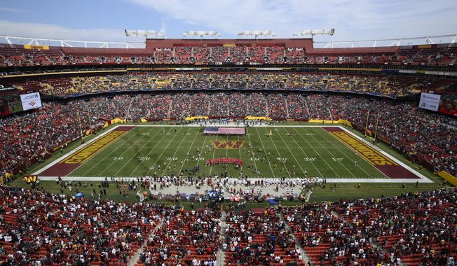 FedEx Field, home of the Washington Commanders NFL football team, is shown before the start of a football game between the Philadelphia Eagles and Washington Commanders, Sunday, Sept. 25, 2022, in Landover, Md. A group led by Josh Harris and Mitchell Rales that includes Magic Johnson has an agreement in principle to buy the NFL&#x27;s Washington Commanders from longtime owner Dan Snyder for a North American professional sports team record $6 billion, according to a person with knowledge of the situation. The person spoke to The Associated Press on condition of anonymity Thursday, April 13, 2023, because the deal had not been announced. (AP Photo/Nick Wass, File)