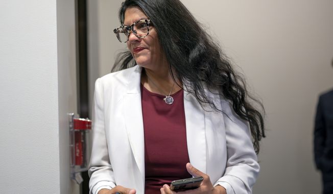 Rep. Rashida Tlaib, D-Mich., arrives for a closed-door Democratic Caucus meeting amid controversial remarks made by Rep. Pramila Jayapal, D-Wash., that criticized the Israeli government of racist policies toward Palestinians, at the Capitol in Washington, Tuesday, July 18, 2023. Rep. Tlaib is the first woman of Palestinian descent in Congress. (AP Photo/J. Scott Applewhite)