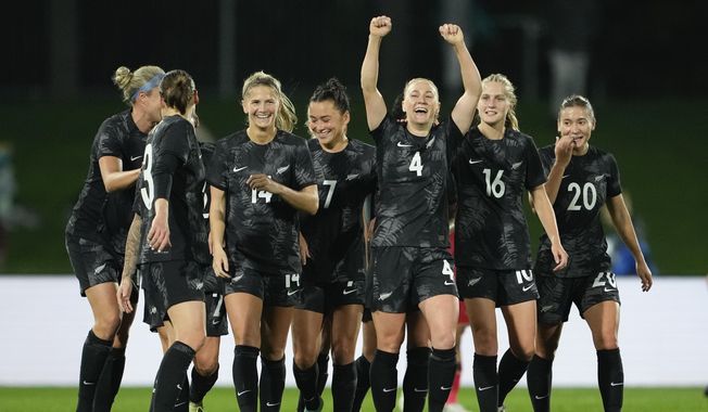 New Zealand&#x27;s CJ Bott, third right, reacts after scoring her team&#x27;s first goal during the New Zealand and Vietnam warm up match ahead of the women&#x27;s World Cup in Napier, New Zealand, Monday, July 10, 2023. (AP Photo/John Cowpland )
