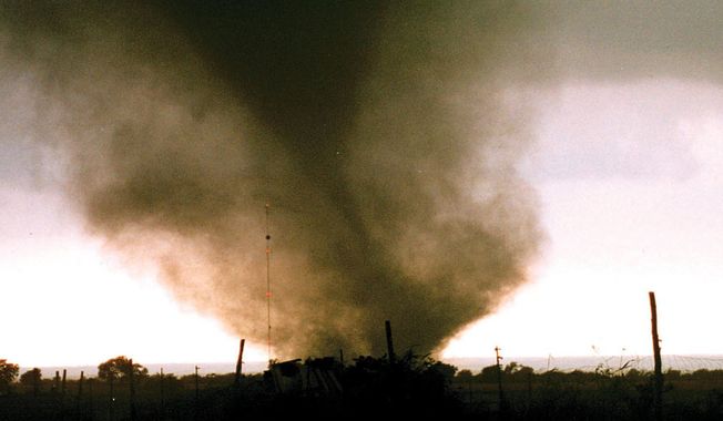 A tornado cuts across the ground near Jarrell, Texas, Tuesday, afternoon, May 27, 1997. At least 30 people were killed and scores more injured as several tornadoes cut a swath through at least three Central Texas Counties. (AP Photo/Theresa Schuch)