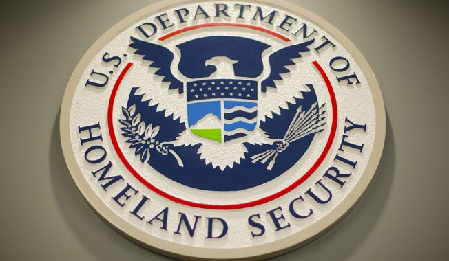 Homeland Security logo is seen during a joint news conference in Washington, Feb. 25, 2015. (AP Photo/Pablo Martinez Monsivais, File)  **FILE**