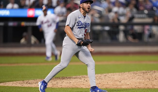 Los Angeles Dodgers relief pitcher Alex Vesia reacts after the final out of the eighth inning of a baseball game against the New York Mets at Citi Field, Sunday, July 16, 2023, in New York. (AP Photo/Seth Wenig)