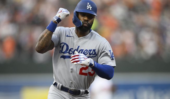 Los Angeles Dodgers&#x27; Jason Heyward gestures as he rounds the bases on his three-run home run during the second inning of a baseball game against the Baltimore Orioles, Tuesday, July 18, 2023, in Baltimore. (AP Photo/Nick Wass)
