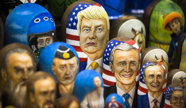 In this photo taken on Thursday, March 2, 2017, Matryoshkas, traditional Russian wooden dolls, including a doll of U.S. President Donald Trump, top, are displayed for sale in Moscow, Russia. From Moscow, the U.S. election looks like a contest between who dislikes Russia most, according to Kremlin spokesman Dmitry Peskov. Russian President Vladimir Putin is frustrated with President Donald Trump&#x27;s failure to deliver on his promise to fix ties between the countries. But Democratic challenger Joe Biden does not offer the Kremlin much hope either. (AP Photo/Alexander Zemlianichenko, File)