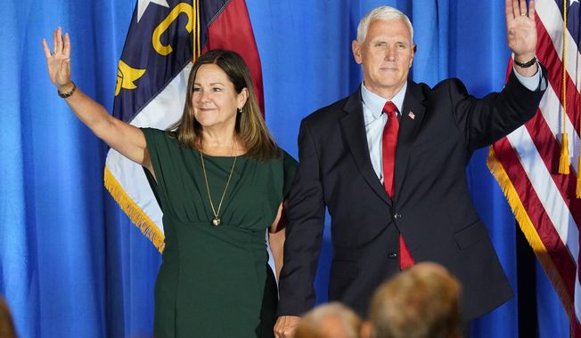 Republican presidential candidate former Vice President Mike Pence waves on stage with his wife Karen after he spoke during the North Carolina Republican Party Convention in Greensboro, N.C., June 10, 2023. Pence is leaning in on his anti-abortion stance as he campaigns for the Republican presidential nomination. Pence says he does not support exceptions in the case of nonviable pregnancies, when doctors have determined there is no chance a baby will survive outside the womb.(AP Photo/Chuck Burton) **FILE**