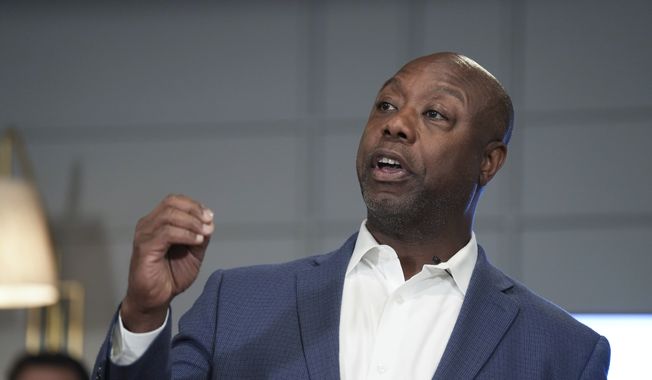 Sen. Tim Scott, R-S.C., speaks with students during an event discussing Opportunity Zones on Friday, June 30, 2023, in Charleston, S.C. Scott, who is seeking the 2024 GOP presidential nomination, was the leading proponent of the Opportunity Zones tax incentive pass into law in 2017 and frequently promotes it during his presidential campaign. (AP Photo/Meg Kinnard)