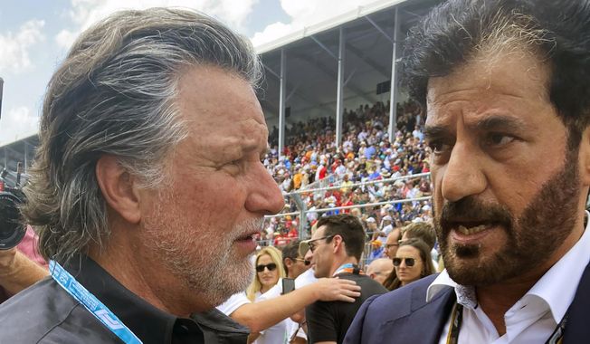 Michael Andretti, left, talks with FIA President Mohammed bin Sulayem before the Formula 1 Miami Grand Prix auto race at Miami International Autodrome, Sunday, May 8, 2022, in Miami Gardens, Fla. The FIA has received “more than five” expressions of interest from teams interested in joining Formula One, the president of the governing body told The Associated Press on Wednesday, July 5, 2023, with a decision on expansion expected by the end of the month. The bid that stands out most to Mohammed Ben Sulayem is from Andretti Global and General Motors — a supportive sign that Michael Andretti may indeed get the F1 team he&#x27;s been fiercely chasing. (AP Photo/Jenna Fryer, File) **FILE**