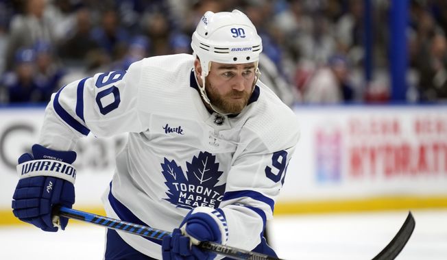 Toronto Maple Leafs center Ryan O&#x27;Reilly plays against the Tampa Bay Lightning during the first period in Game 4 of an NHL hockey Stanley Cup first-round playoff series on April 24, 2023, in Tampa, Fla. On what was technically his first day on the job as general manager, Barry Trotz on Saturday, July 1, 2023, signed a top two-way center in hockey and 2019 playoff MVP Ryan O&#x27;Reilly, rugged Stanley Cup-winning defenseman Luke Schenn and a winger in Gustav Nyquist who has something to prove. (AP Photo/Chris O&#x27;Meara, File)