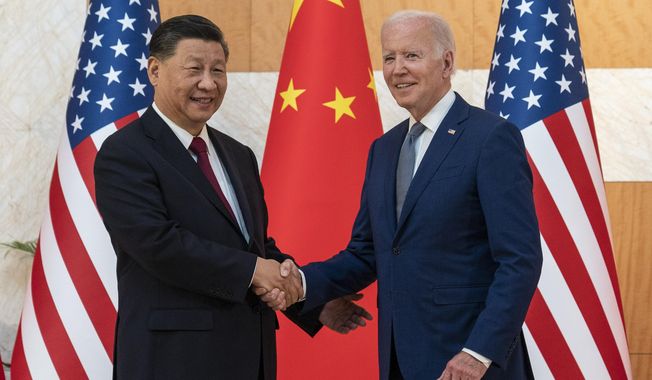 U.S. President Joe Biden, right, and Chinese President Xi Jinping shake hands before a meeting on the sidelines of the G20 summit meeting in Bali, Indonesia Nov. 14, 2022. Leaders of the Group of Seven advanced economies are generally united in voicing concern about China. The question is how to translate that worry into action. (AP Photo/Alex Brandon, File)