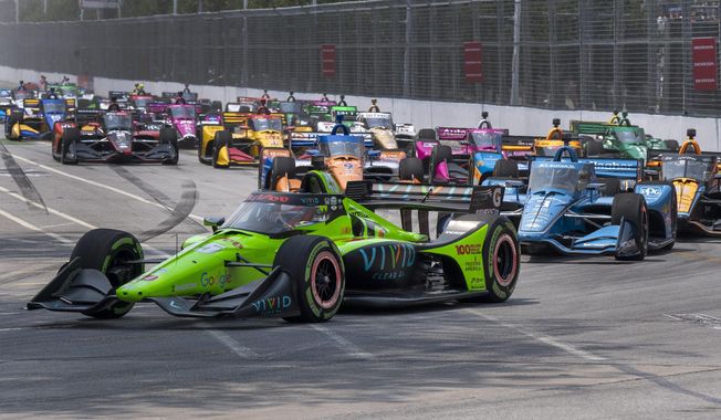 Pole sitter Christian Lundgaard leads the field into turn one at the start of the Honda Indy Toronto auto race in Toronto on Sunday, July 16, 2023. (Frank Gunn/The Canadian Press via AP)
