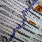 U.S. $100 bills are seen, Thursday, July 14, 2022, in Marple Township, Pa. (AP Photo/Matt Slocum)