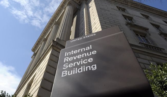 The exterior of the Internal Revenue Service (IRS) building in Washington on March 22, 2013. The IRS is showcasing its new capability to aggressively audit high-income tax dodgers as it makes the case for sustained funding and tries to avert budget cuts sought by Republicans who want to gut the agency. IRS leaders said they collected $38 million in delinquent taxes from more than 175 high-income taxpayers in the past few months.(AP Photo/Susan Walsh, File)
