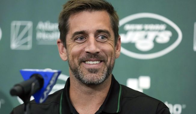 New York Jets&#x27; quarterback Aaron Rodgers smiles during an NFL football news conference at the Jets&#x27; training facility in Florham Park, N.J., Wednesday, April 26, 2023. The New York Jets&#x27; first training camp with new quarterback Aaron Rodgers is getting the “Hard Knocks” treatment. The team announced its featured role on the long-running HBO and NFL Films show on Monday, July 17, 2023. (AP Photo/Seth Wenig, File)